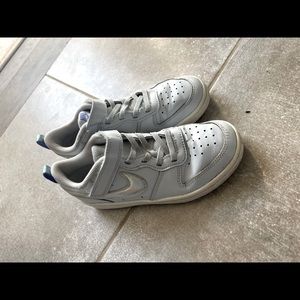 Girl Nike low top size 2.  Good shape with some wear.